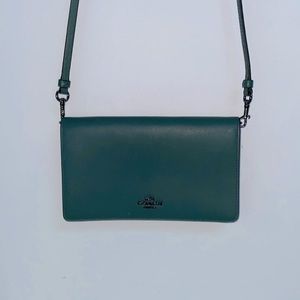 Dark green hand bag with a detachable strap
